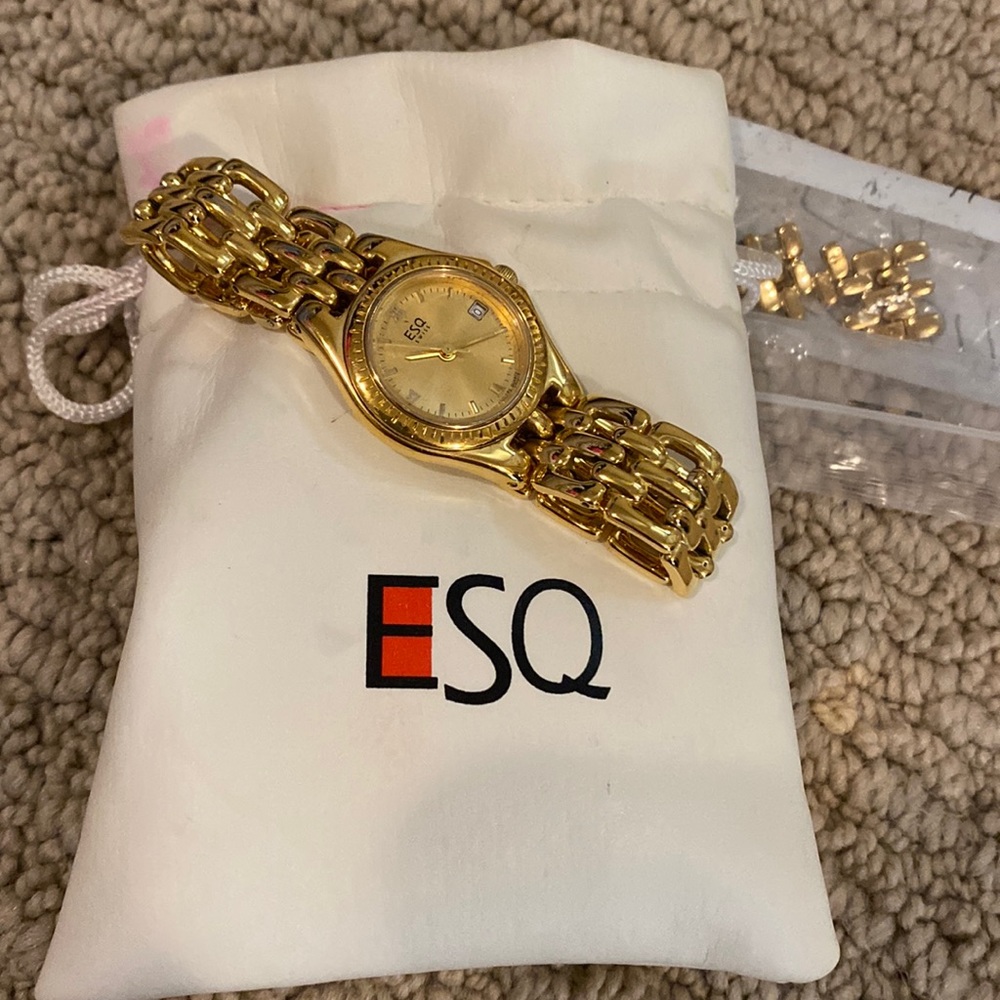 ESQ gold plated link bracelet watch with gold face.
